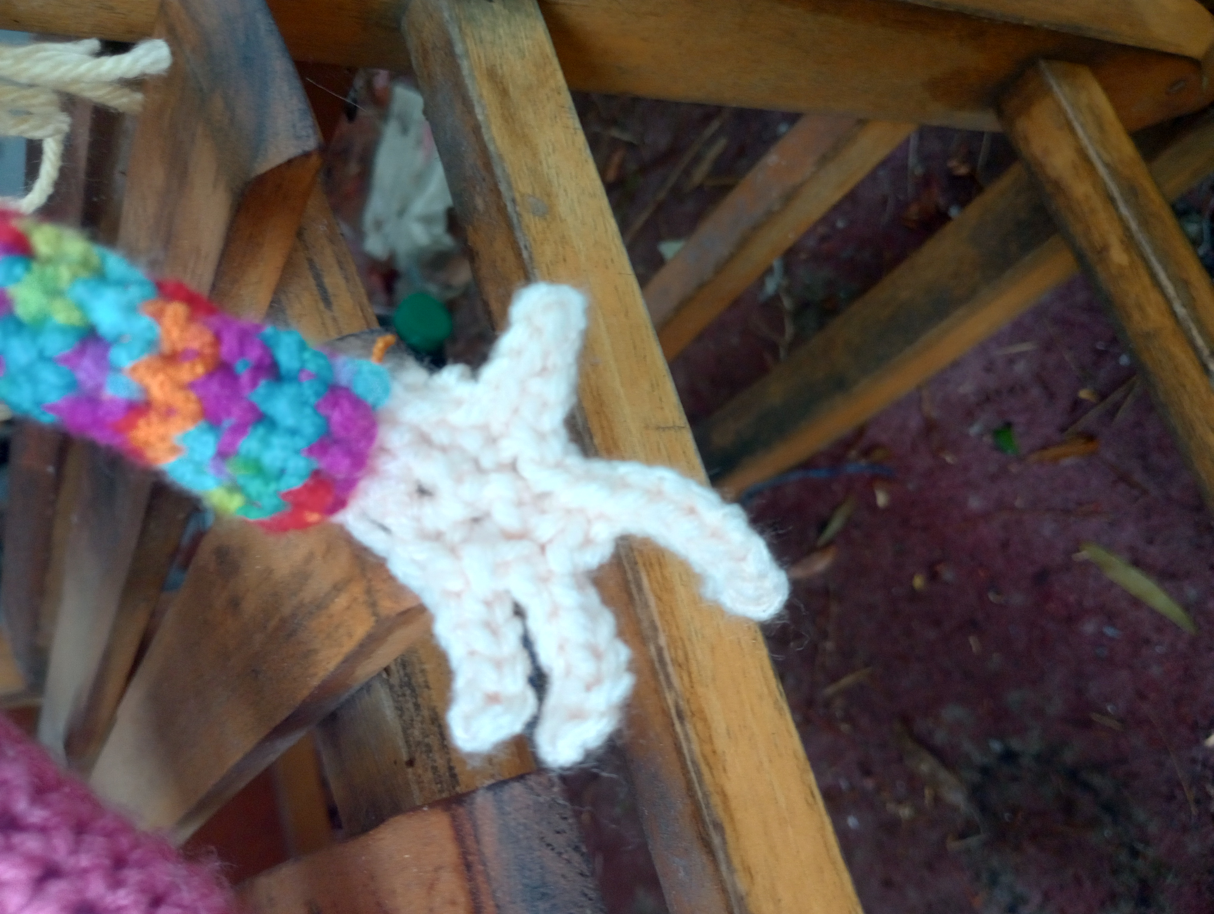 A close-up of the doll's other hand, showing the slightly shorter but much more twisted and offset fingers.
