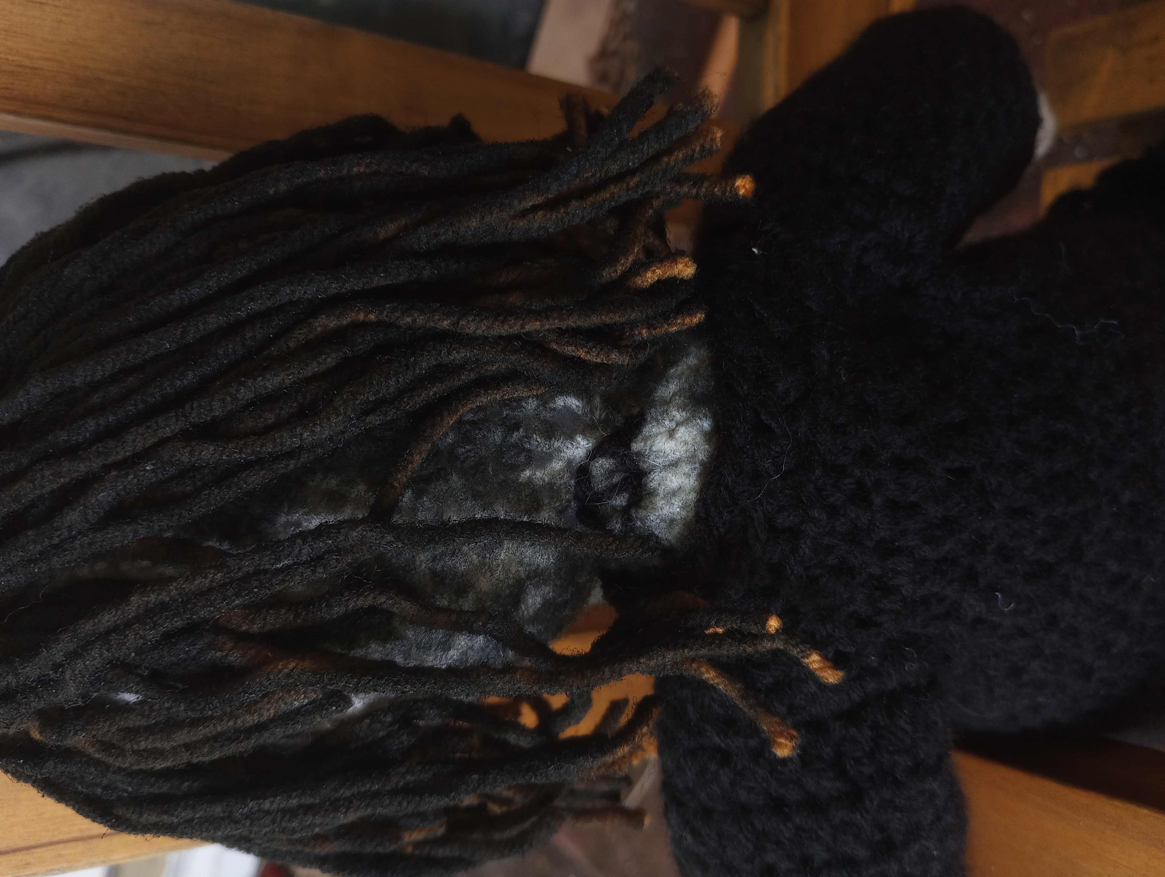 The back of the doll's head, showing the details of the poorly dyed hair