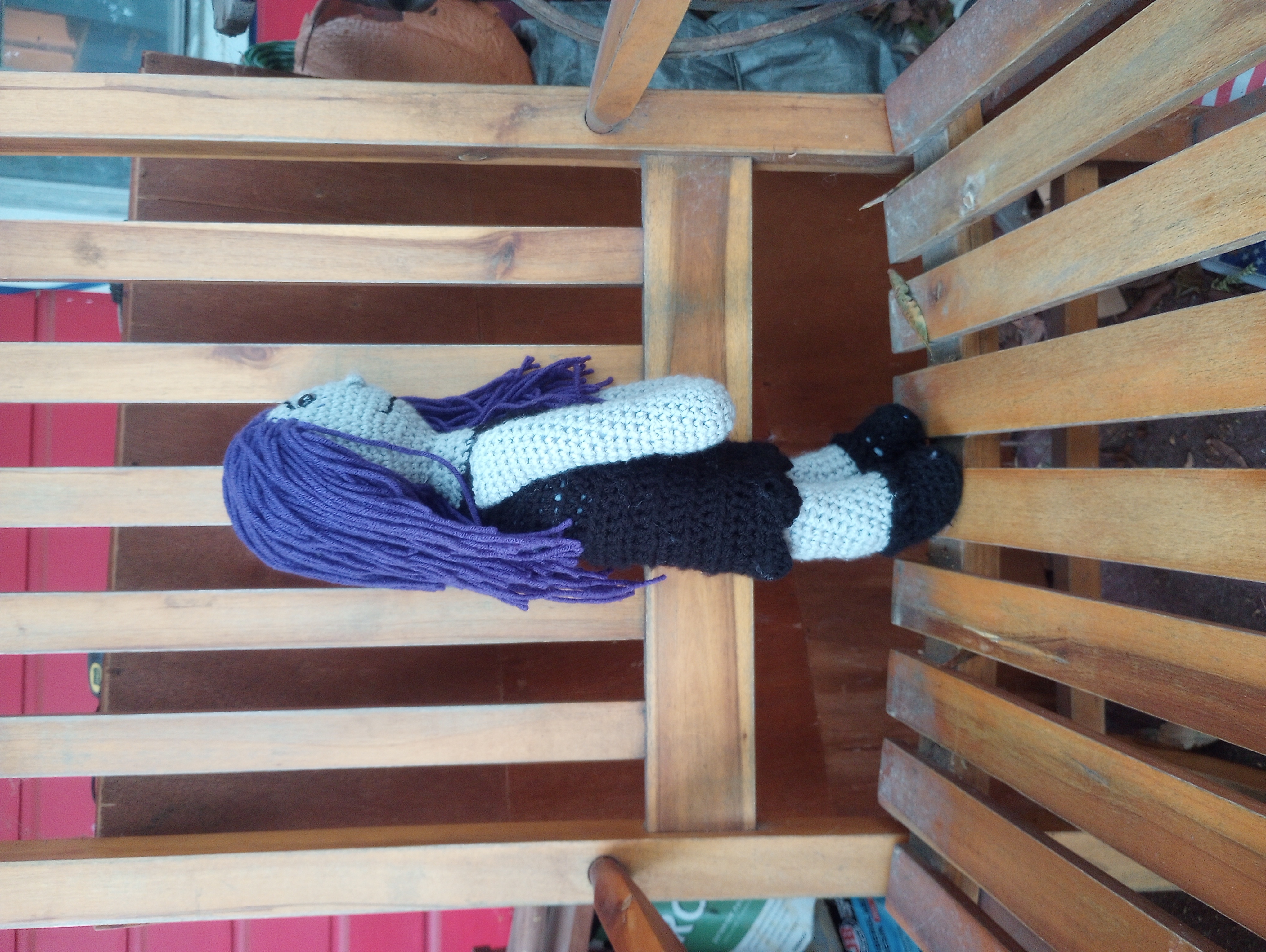 The same doll seen from the side, displaying her hair hanging down her back