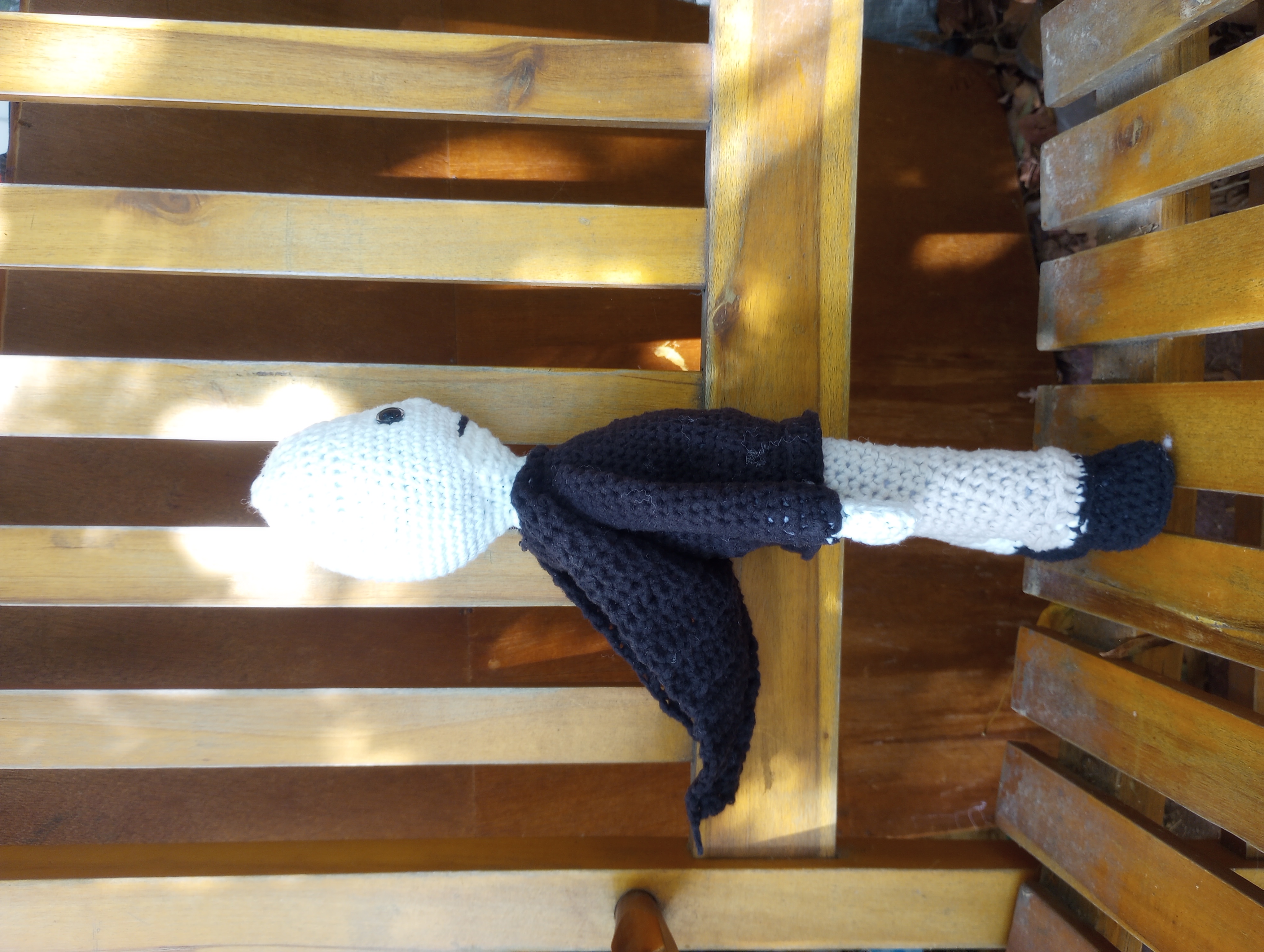 The same doll, shown from the side to display the hood hanging loose down his back