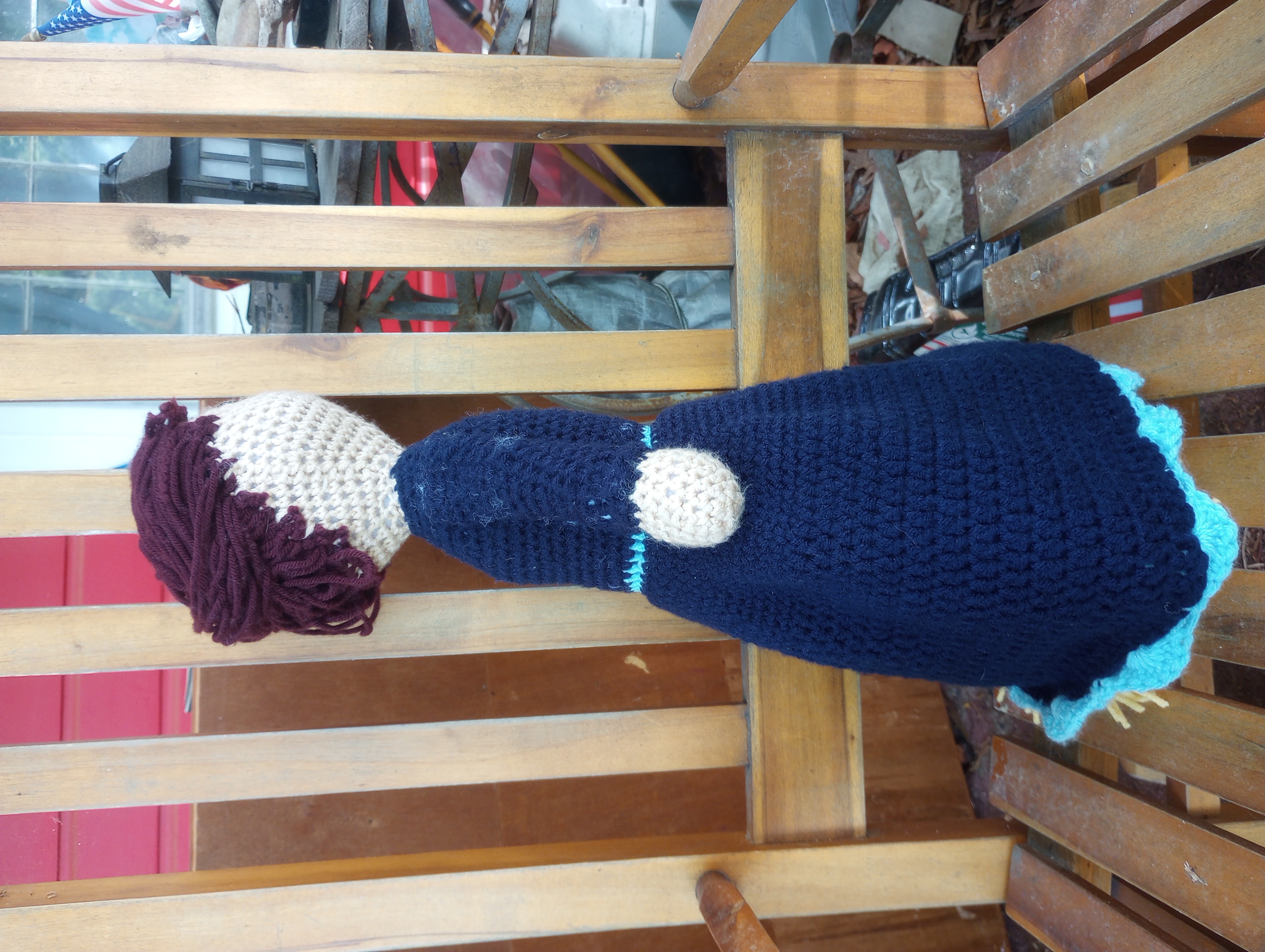 The crocheted Mina, seen from the side to show the hair tied up