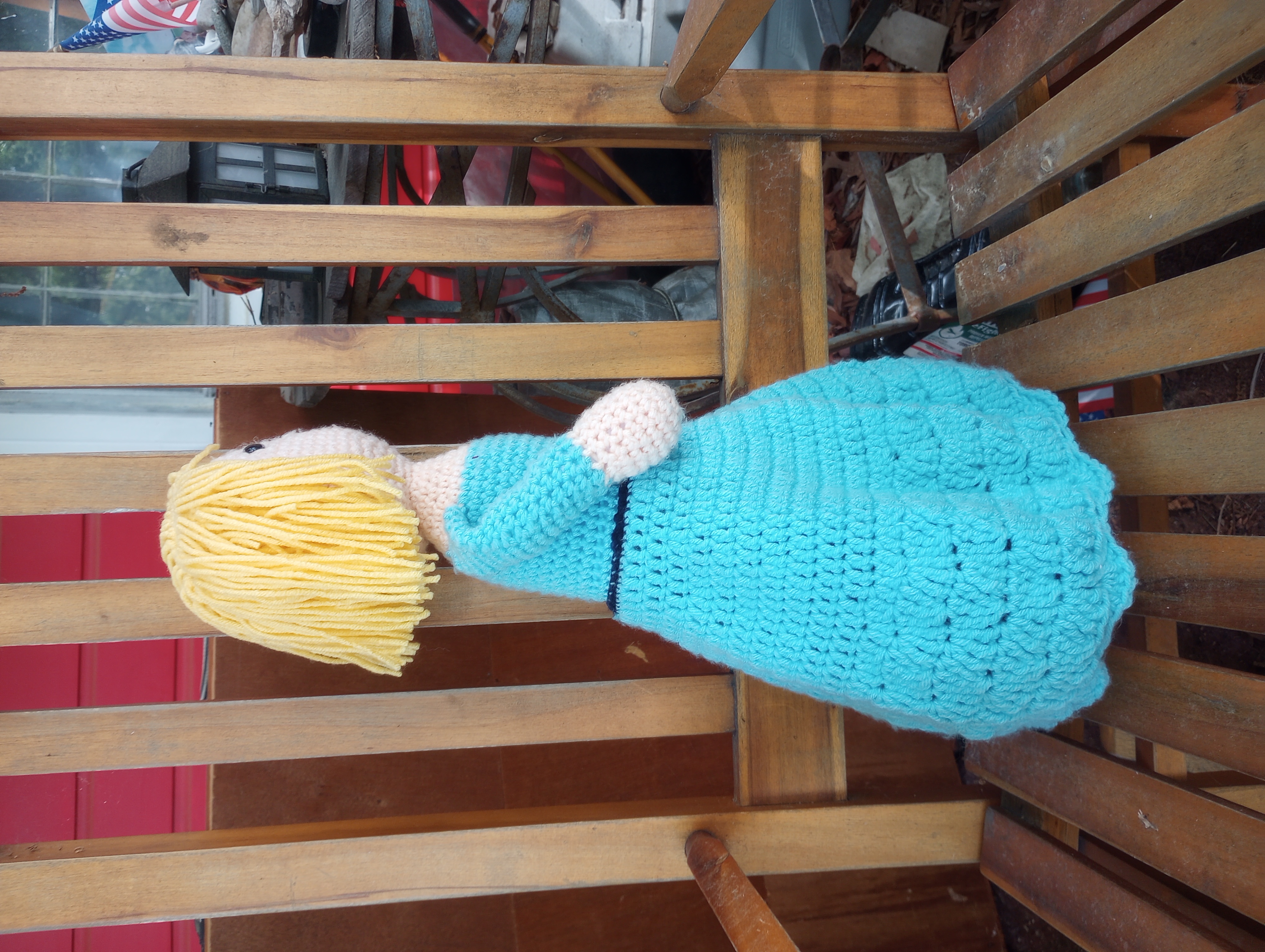 The crocheted Maddie, seen from the side to show the chin-length bob of hair