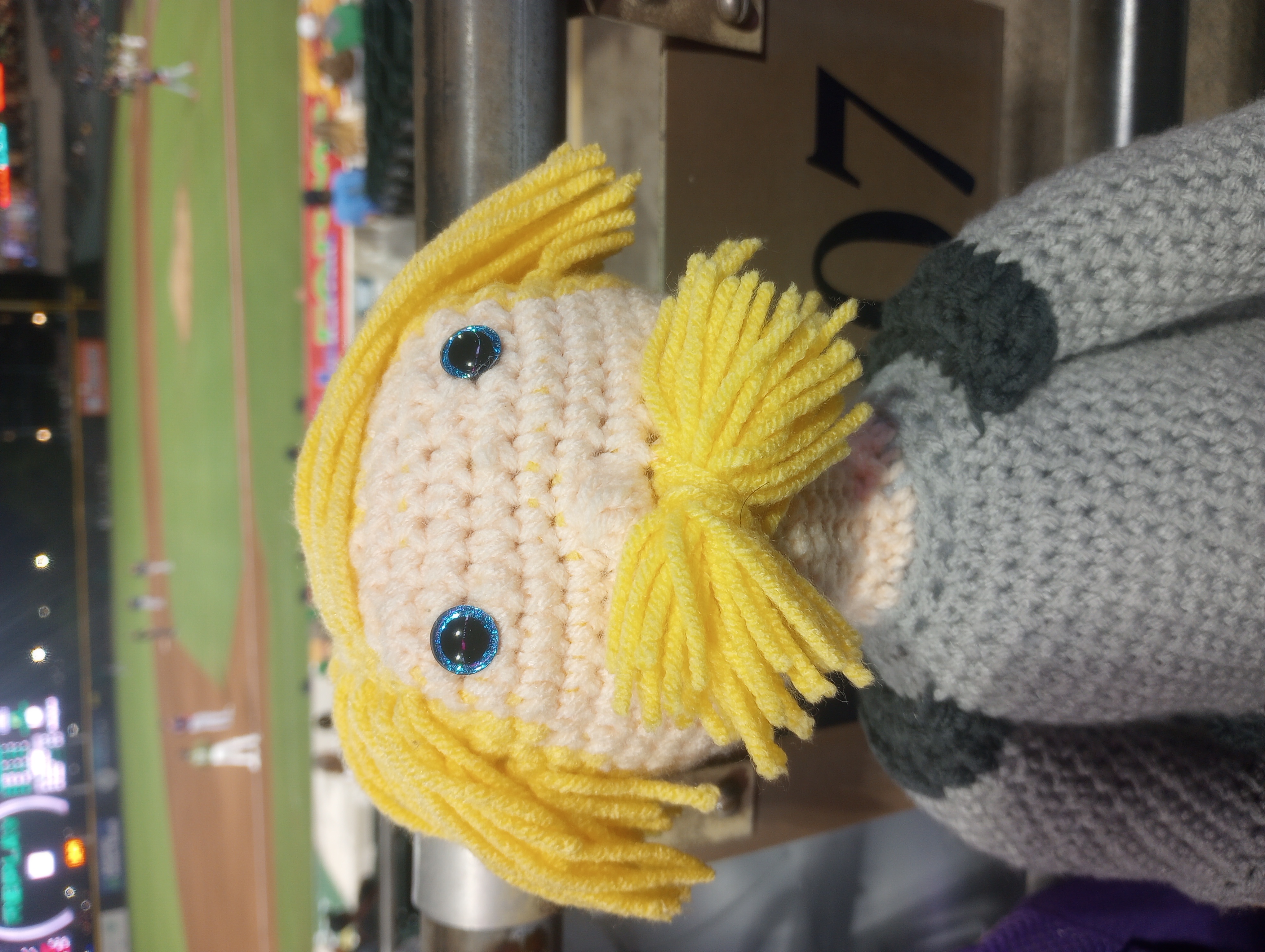 A close-up of the doll's face, bringing the mustache into focus